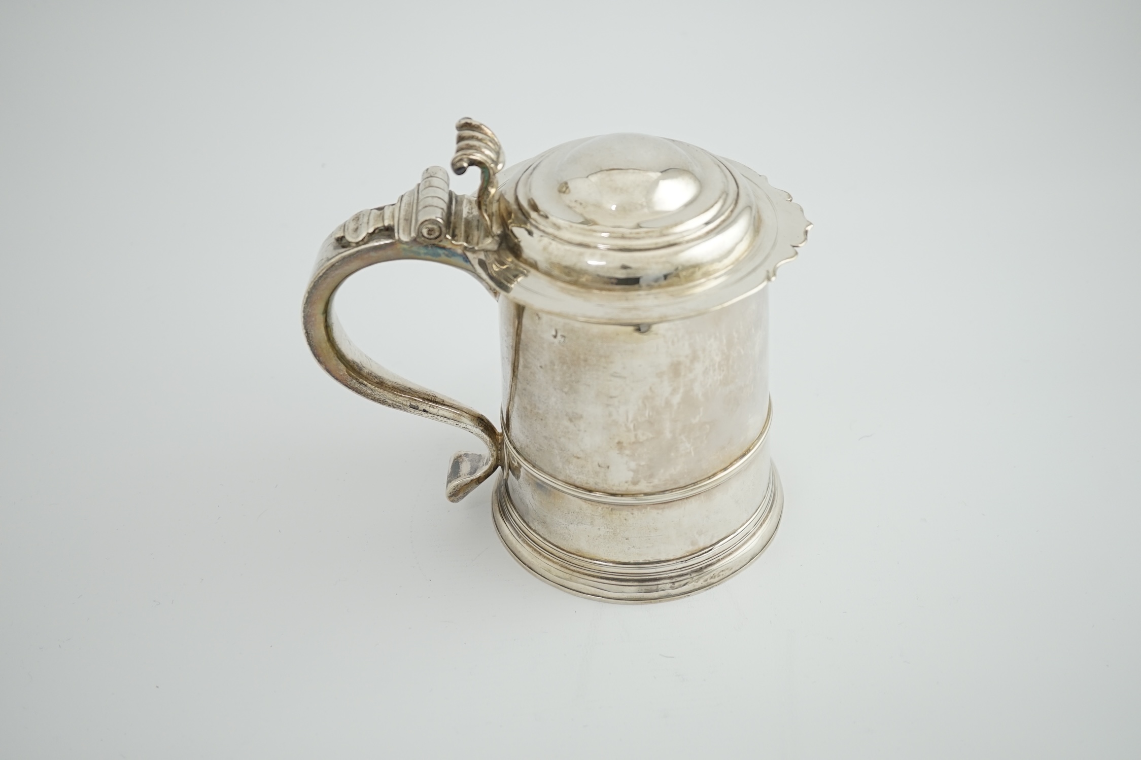 A late Queen Anne Britannia standard silver tankard, maker R?